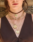 Model wearing various Texas pendants and the pieces of a star chain