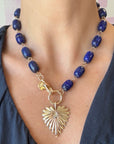 Model wearing the chunky lapis lariat shown at full length with the full heart pendant