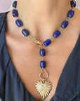 Model wearing the chunky lapis lariat with the full heart pendant