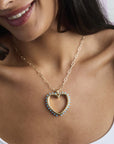 Model wearing the open your heart pendant on the drawn link chain