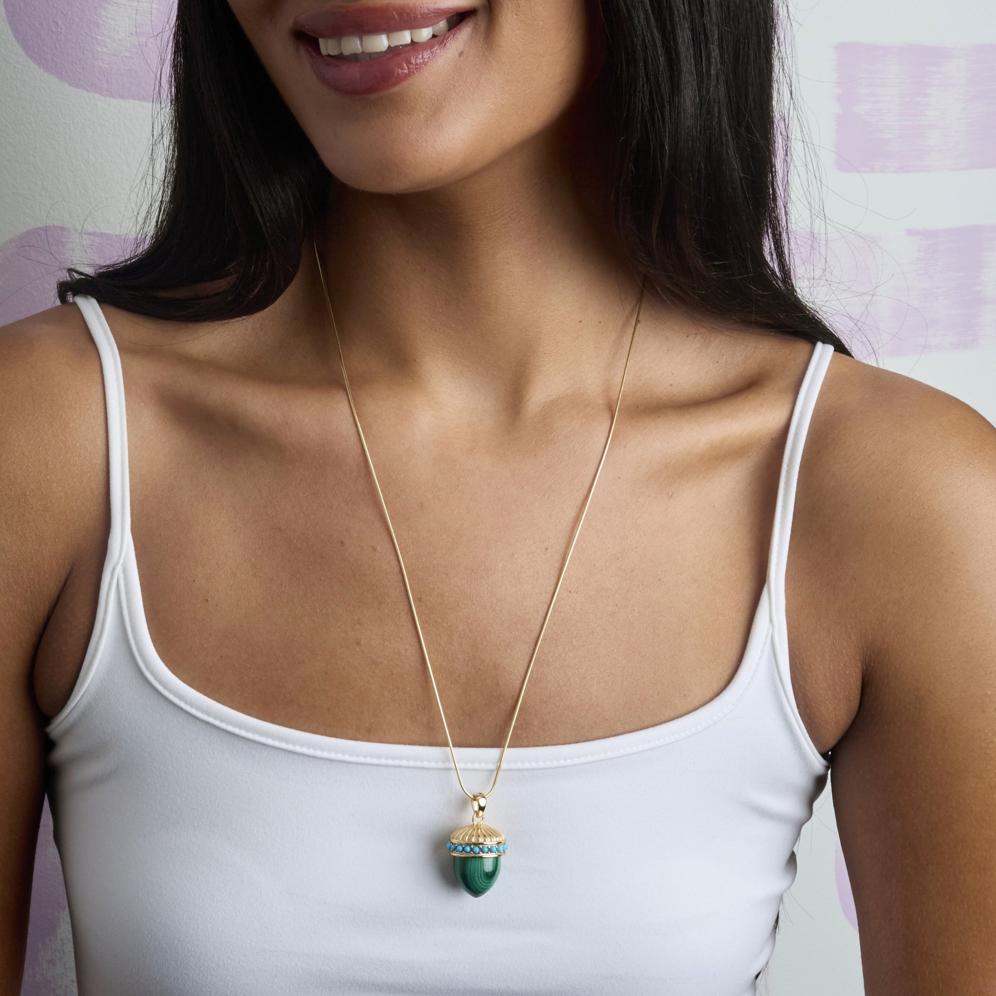 Model wearing the Hope Acorn pendant on the adjustable snake chain
