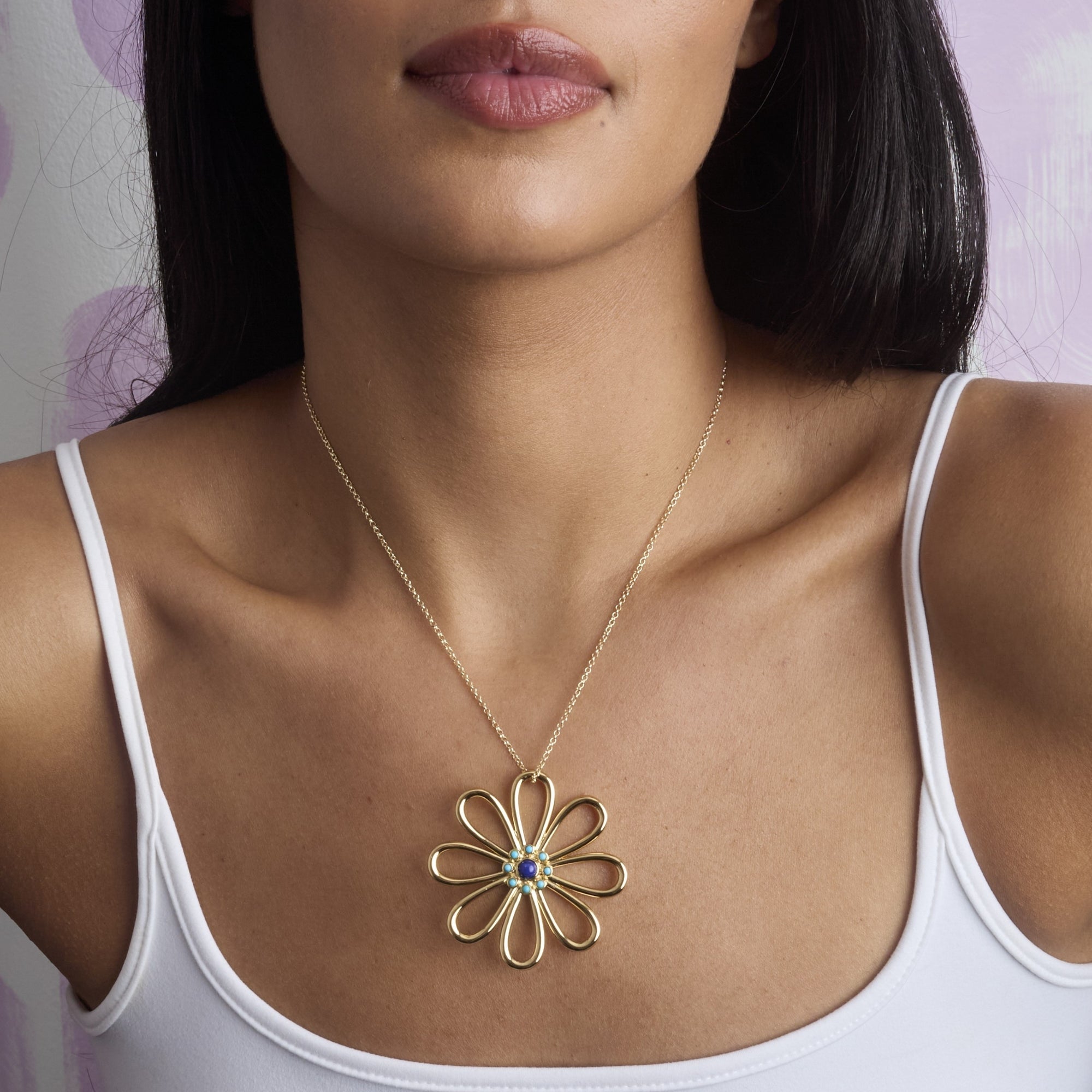Model wearing the daisy chain flower pendant on the classic rolo chain