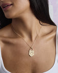 Model wearing hope shield pendant on classic rolo chain