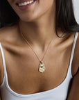 Model wearing the love shield pendant