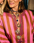 Model wearing various Jane Win x La Vie pendants and chains