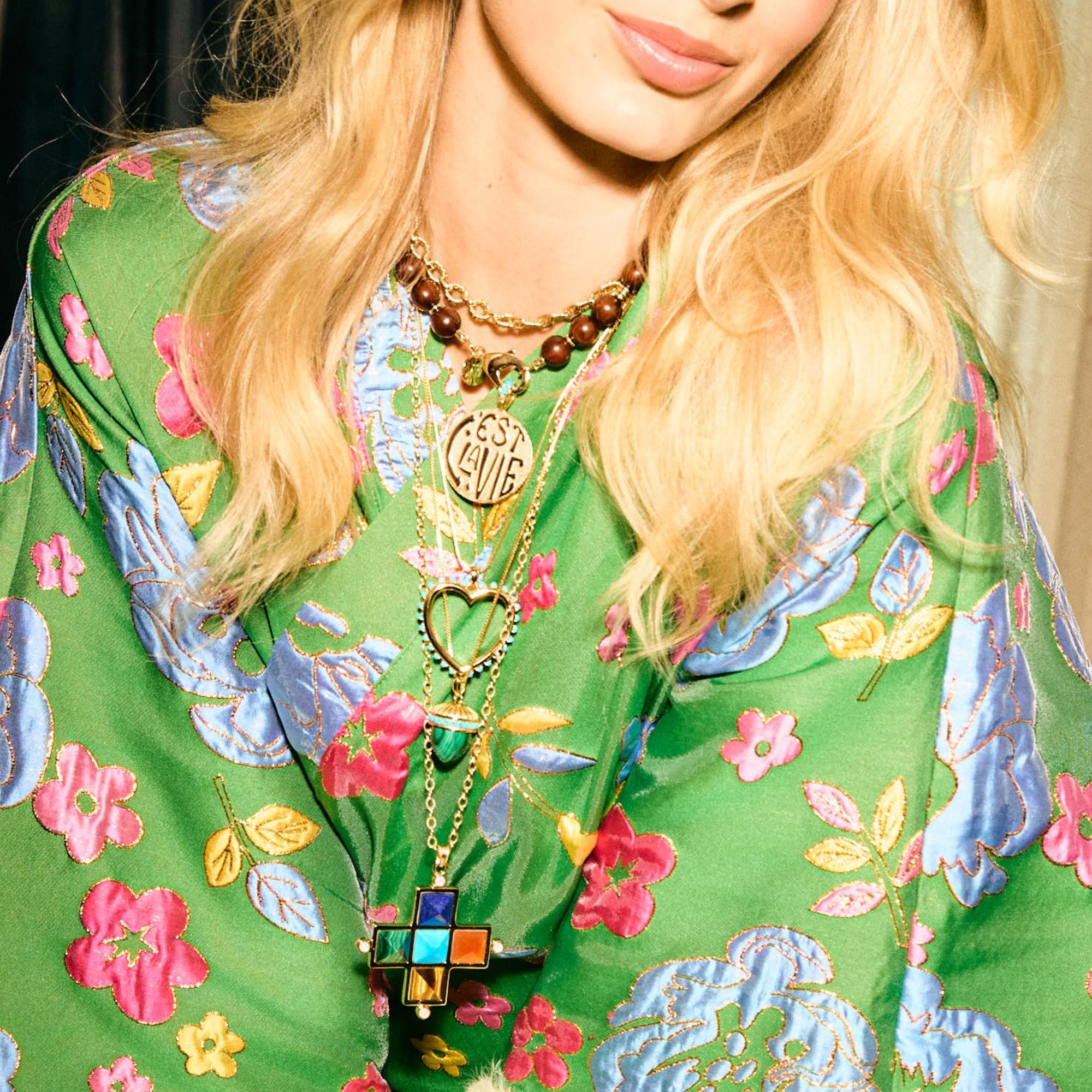 Model wearing various Jane Win x La Vie pendants and chains