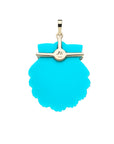 Back of carved turquoise shell shows 10k gold setting