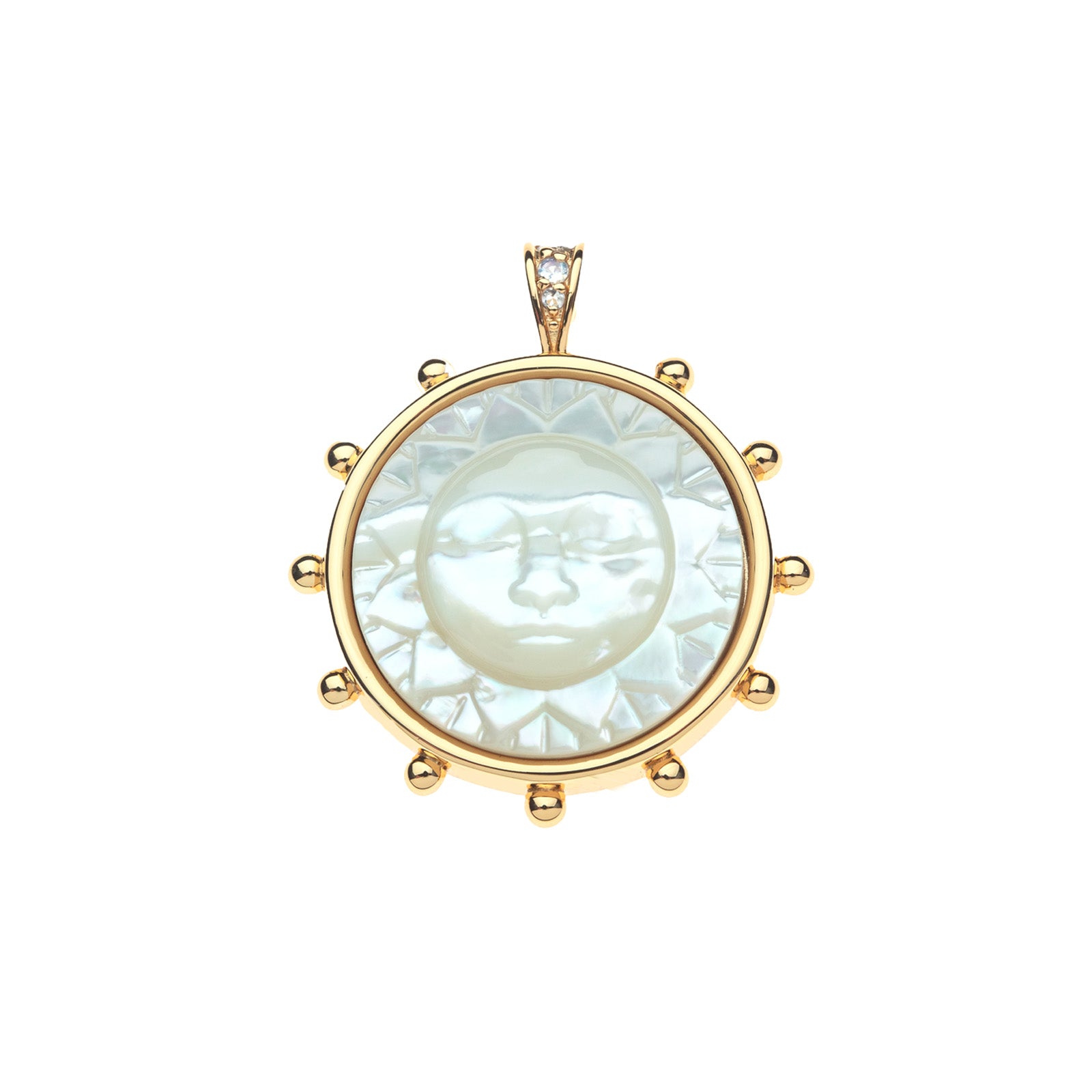 Gold coin pendant features mother of pearl inlay carved with sun face, as well as white topaz accents on the bail