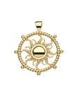 Gold coin pendant features cutout sun motif with yellow topaz accents