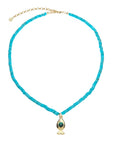Turquoise beaded necklace with gold fish pendant featuring malachite cabochon detail