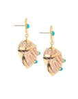 Side view of the strong soaking up the sun earrings
