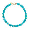 Beaded necklace features chunky turquoise beads with flat gold beads mixed in and oversized gold lobster clasp