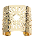 Gold cuff bracelet featuring cutout star burst design 