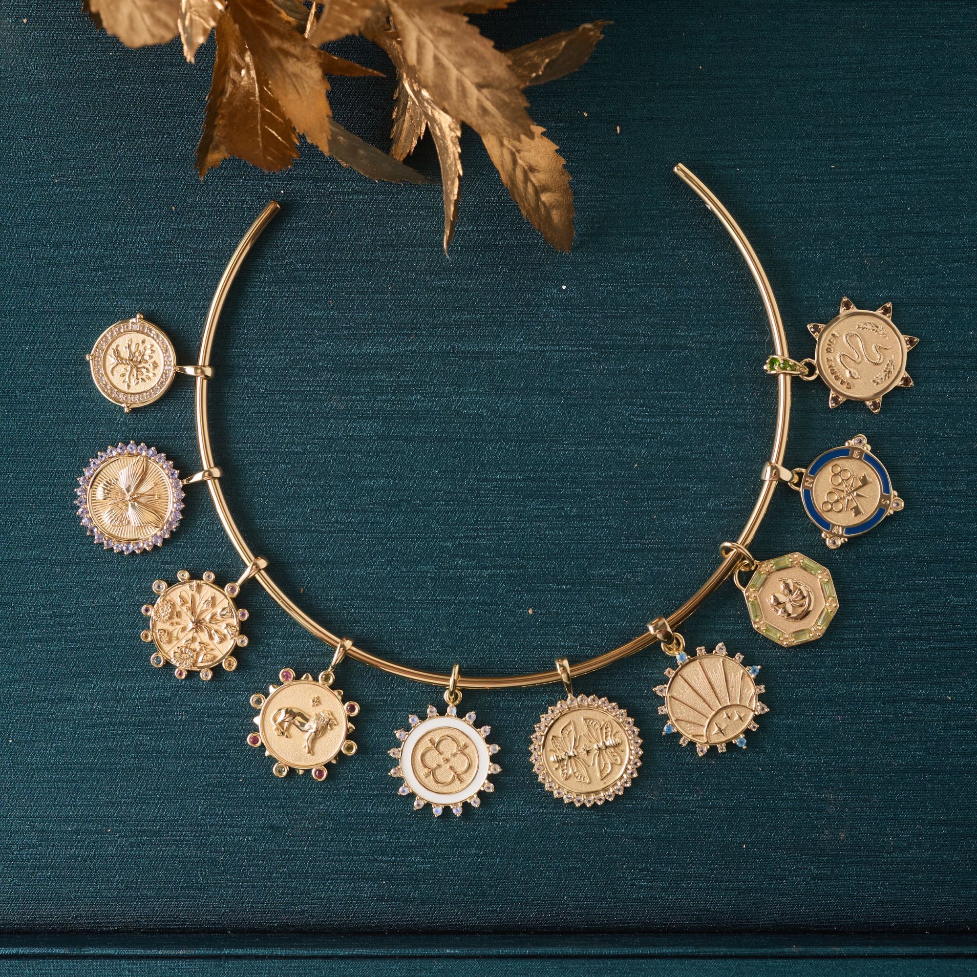 Gold neck cuff with each of the petite embellished coins