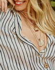 Model wearing assorted love pendants