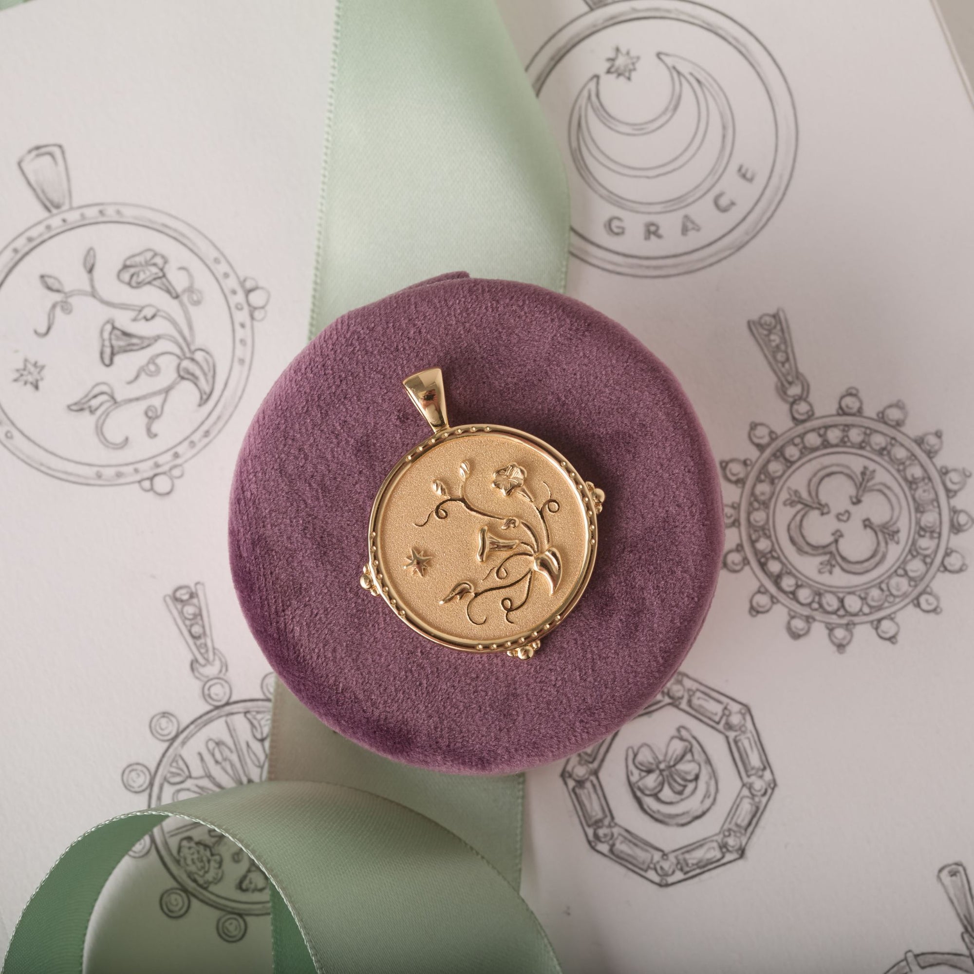 Gold Coin Featuring Morning Glory Floral Design, stylized with sketch of coin and ribbon