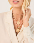 Gold Coin Necklaces Layered on Model