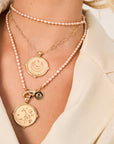 Gold Coin Necklaces Layered on Model