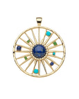 Gold cutout jumbo coin features sun design with lapis cabochon at the center and mix of turquoise, lapis, and green tourmaline stones between the rays