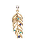 Gold palm leaf pendant featuring lapis and turquoise cabochons, as well as white topaz on the bail