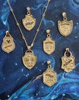Stylized shot of shield pendants on blue background