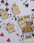 Stylized shot of each of the 4 playing card pendants on top of a pile of playing cards