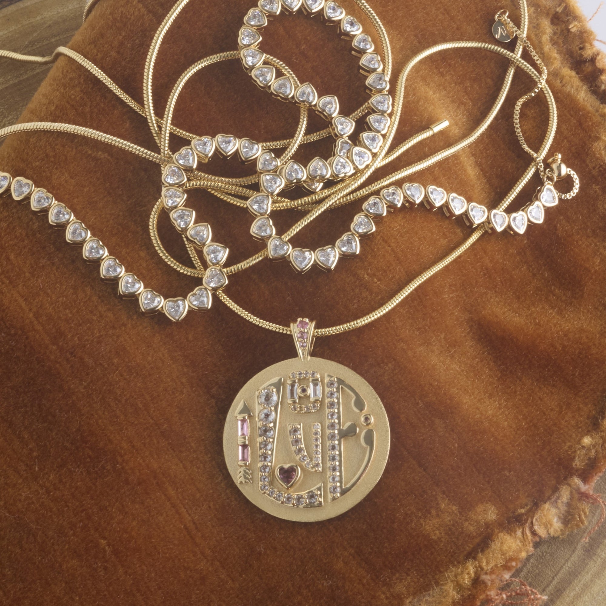 Stylized shot of jumbo love embellished coin with various chains