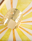 Stylized shot of strong supernova cuff on watercolor painting of sun rays