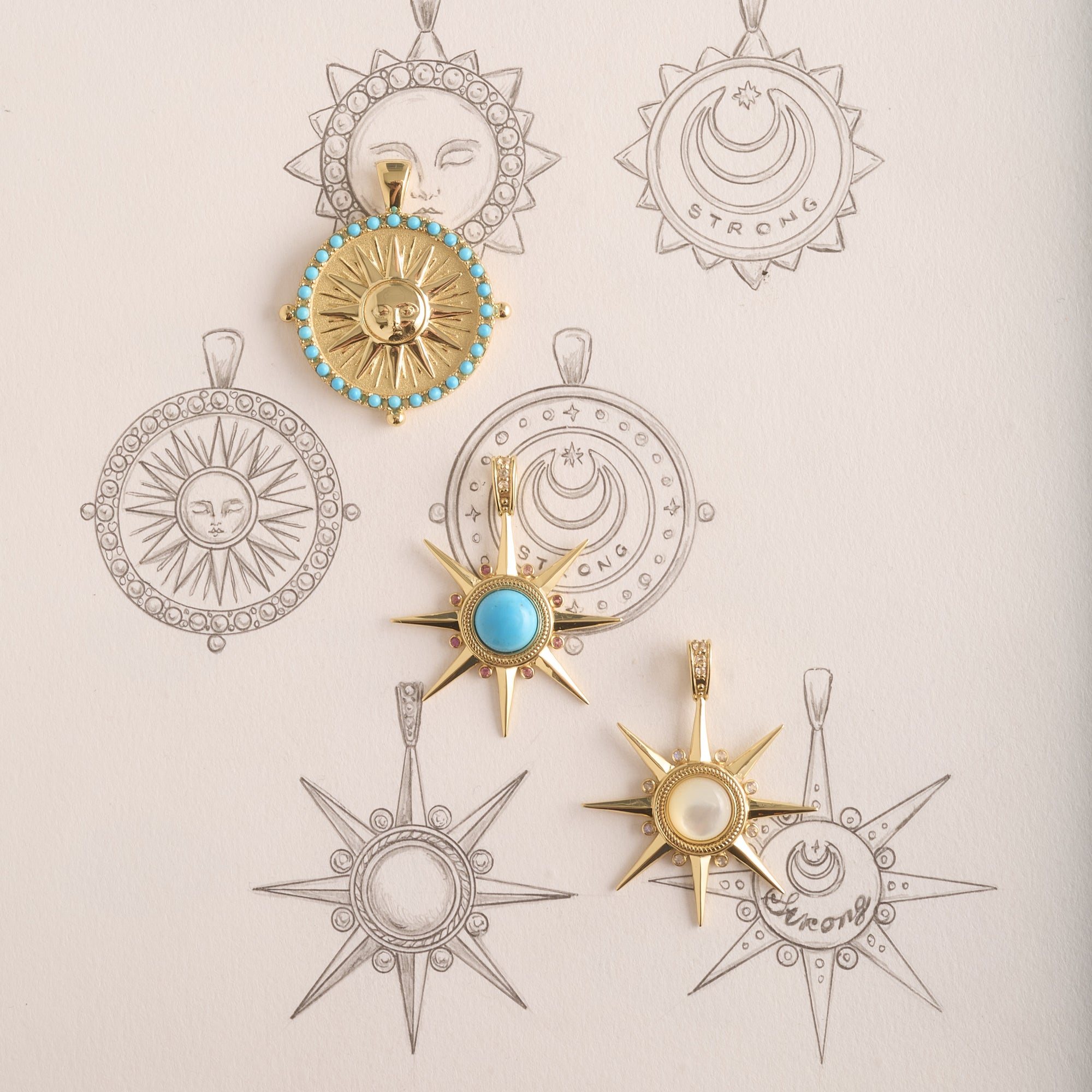 Stylized shot of supernova pendants and sun coin with sketches of various sun designs