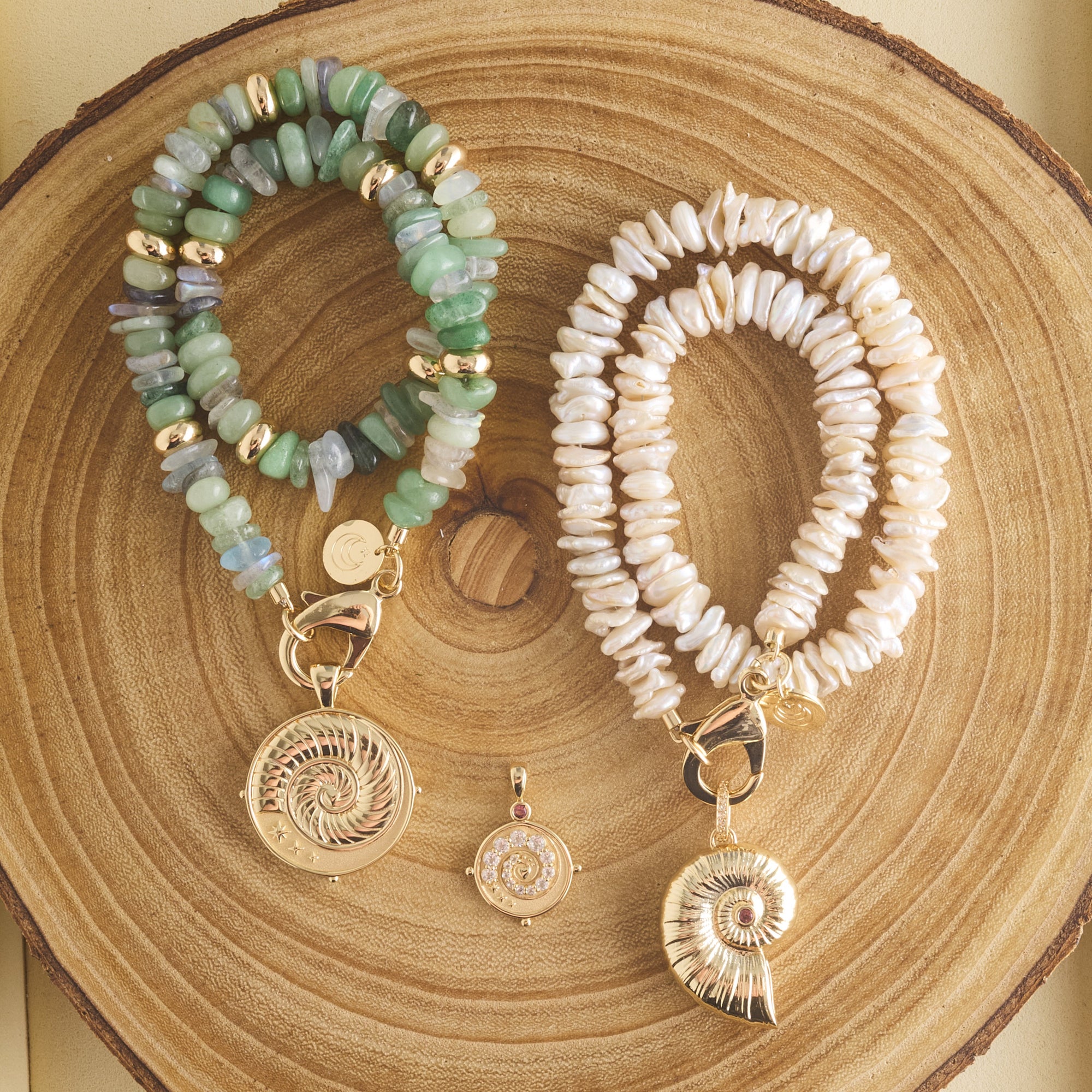 Stylized shot of beaded necklaces with seashell pendants