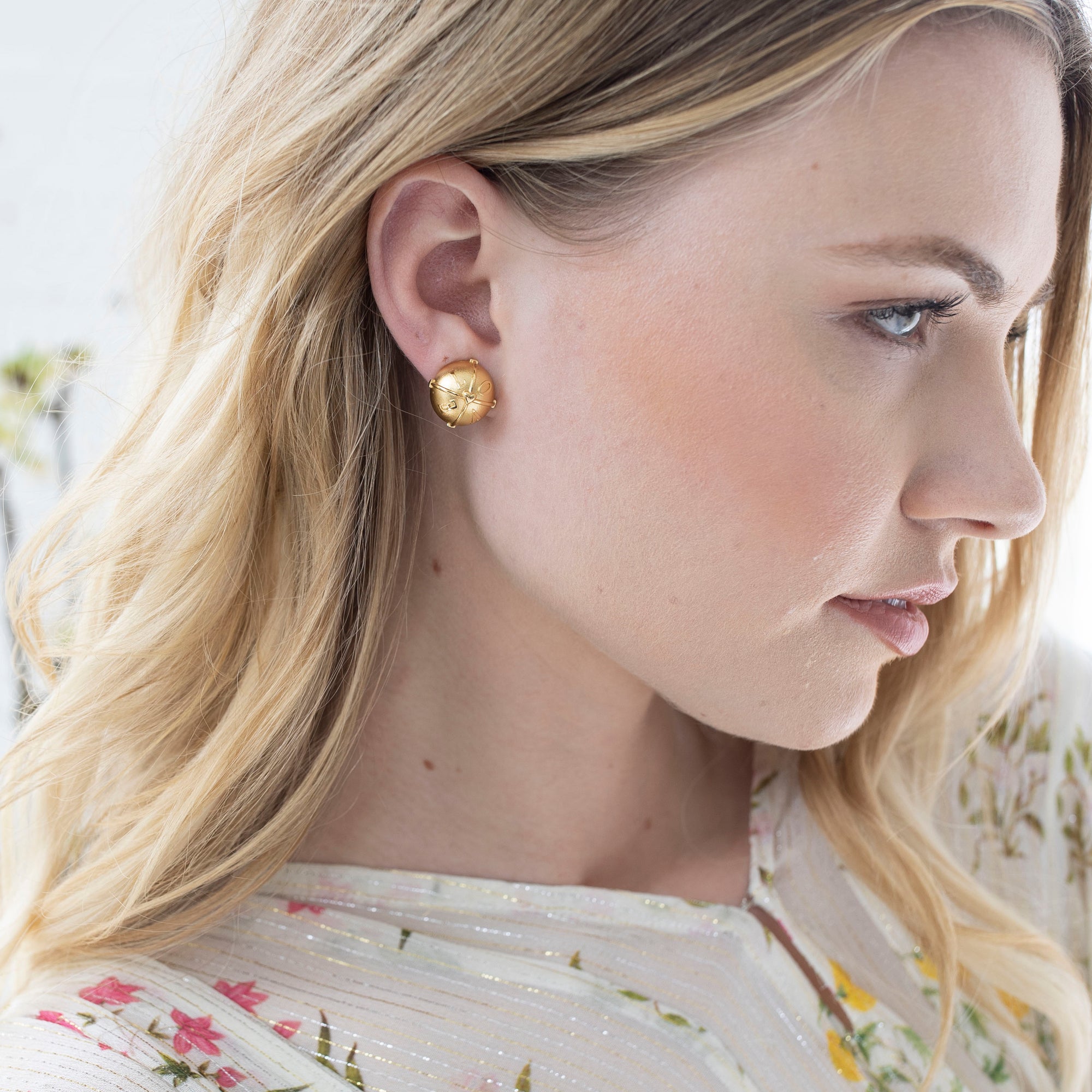 Model wearing the love button stud